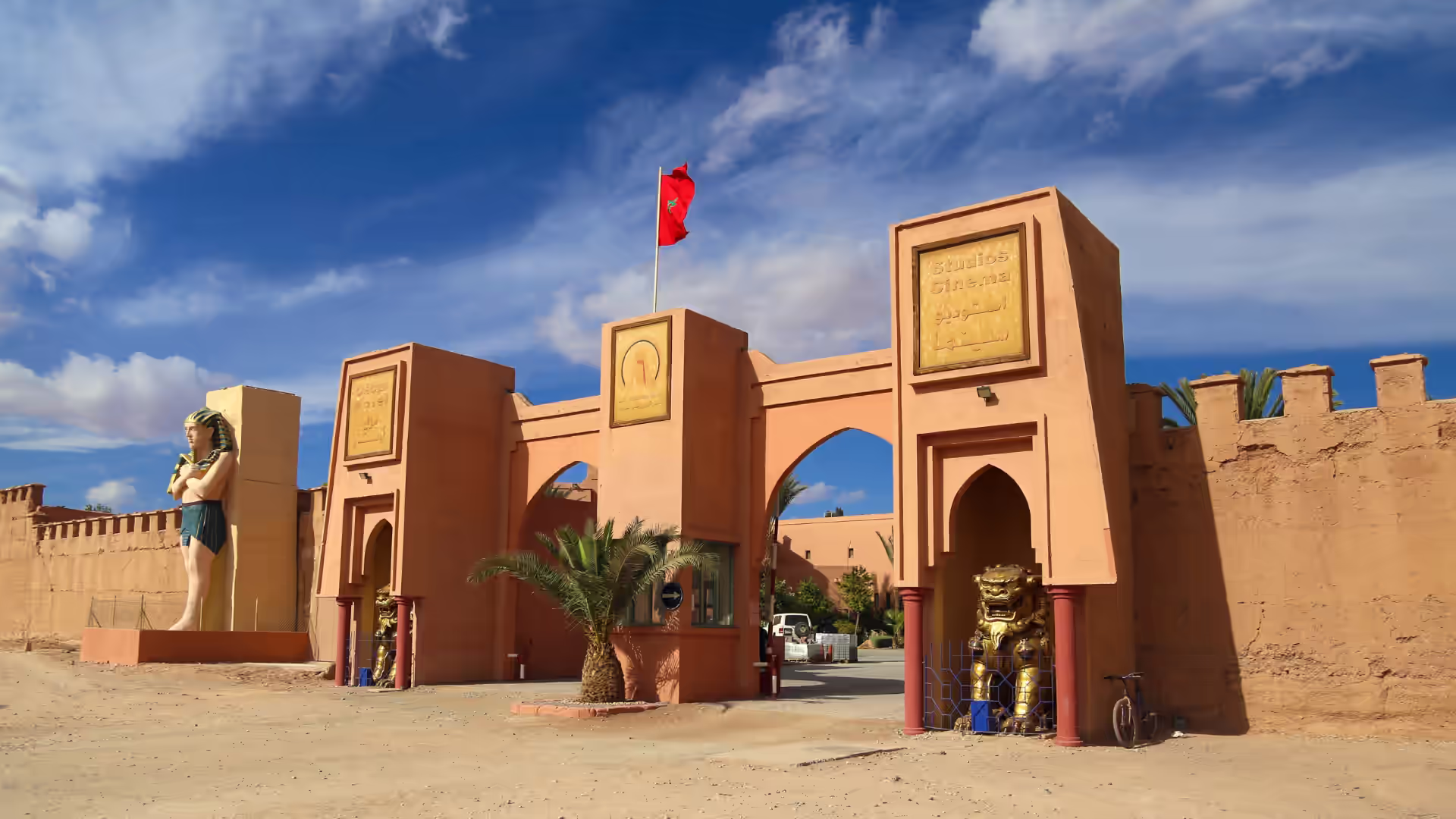 Film set structures standing in the desert at Atlas Studios near Ouarzazate