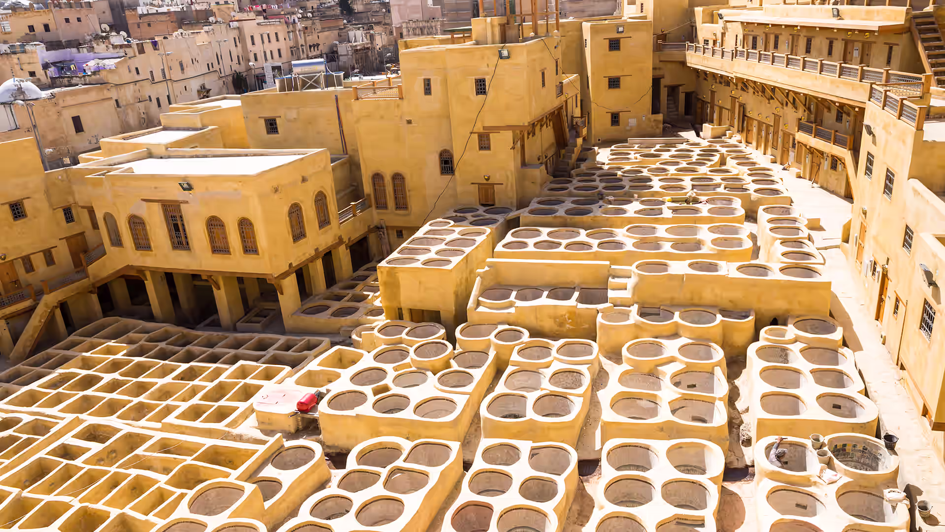 Stone dye pits of the Chouara tannery in Fez seen from a terrace above