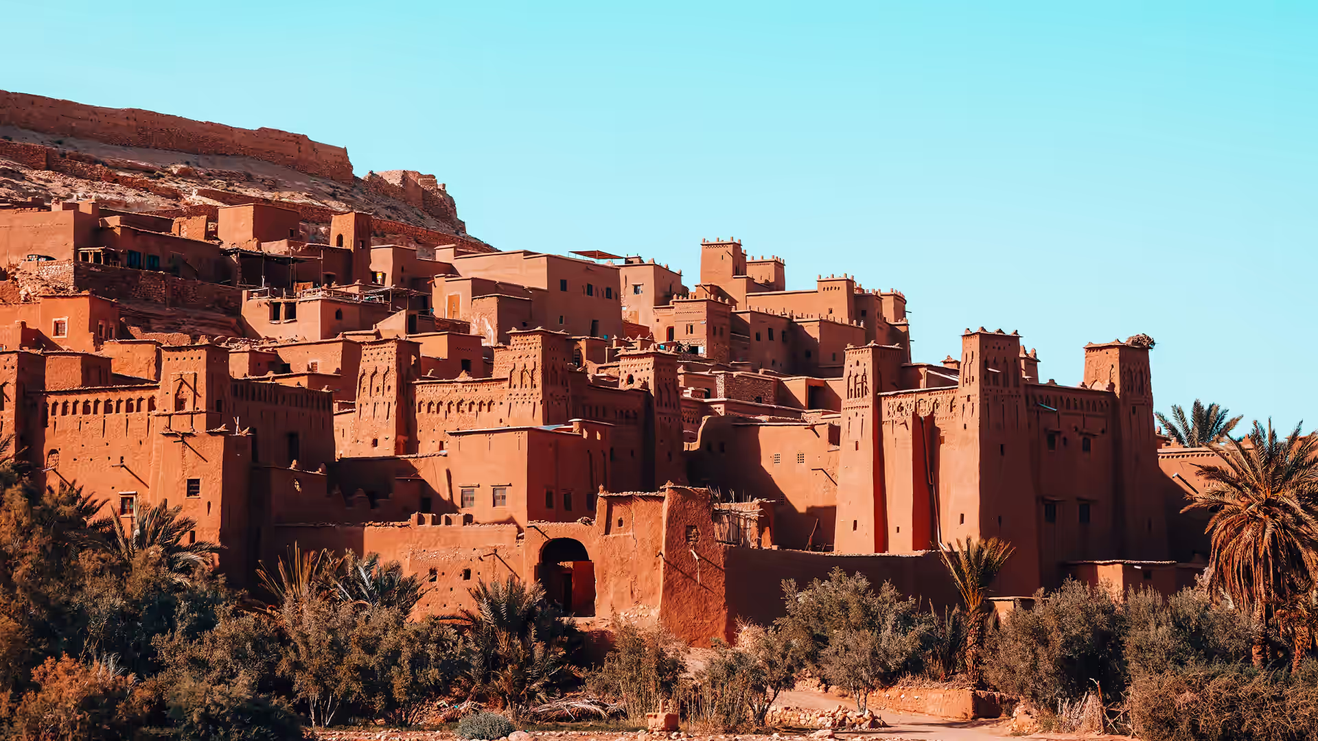 The earthen ksar of Aït Benhaddou rising above the valley in afternoon light