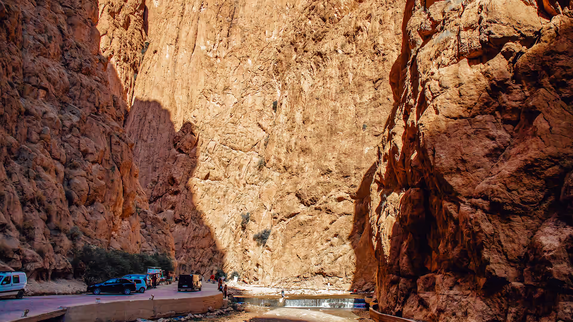 Sheer canyon walls of the Todra gorge with the river and road at the bottom